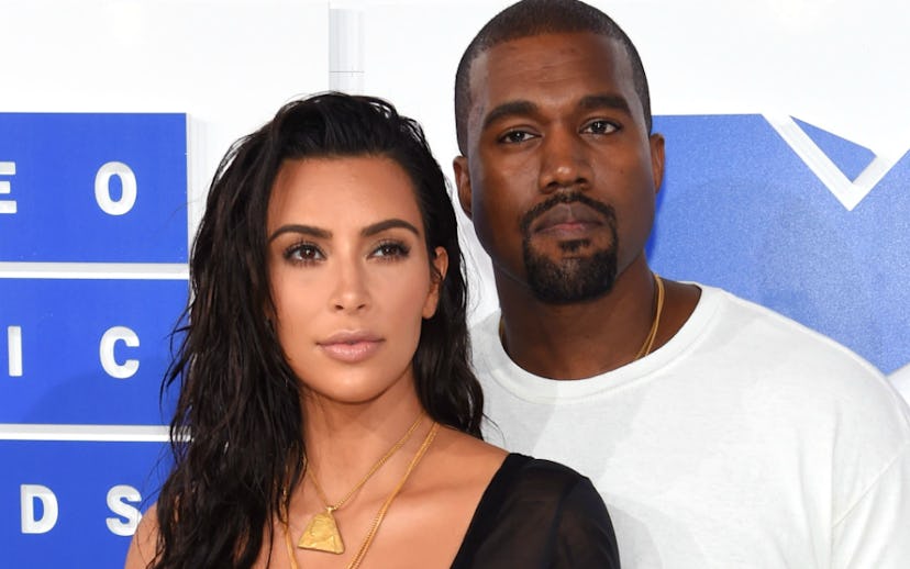 Kanye West and Kim Kardashian posing together for a photo