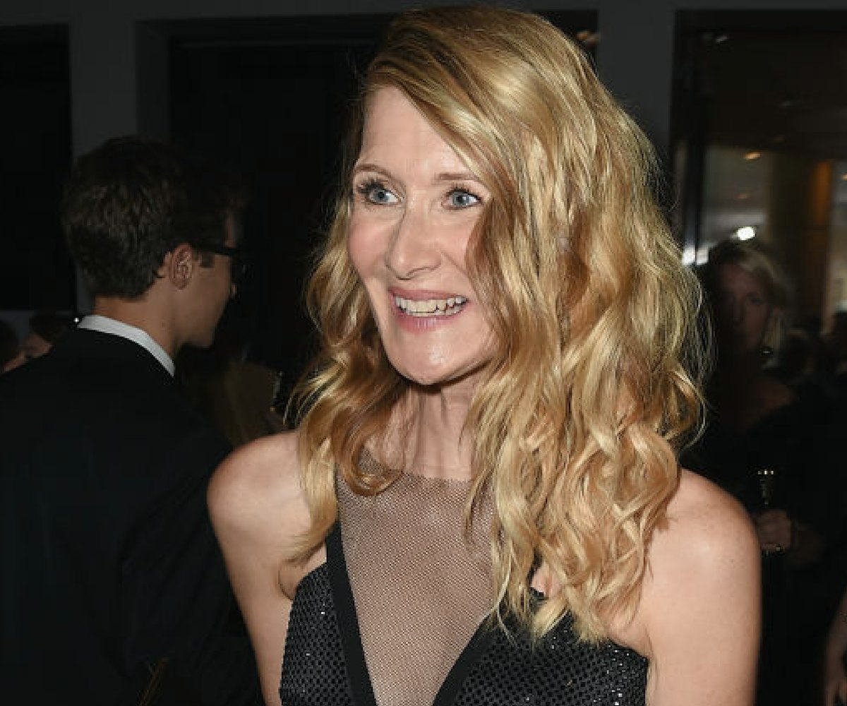 Laura Dern wearing a black glittery gown with mesh covering the gown's deep cleavage on the red carp...