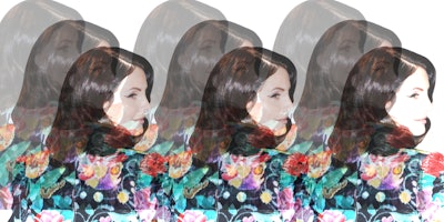 Lana Del Rey in a floral blazer, looking into the distance. 