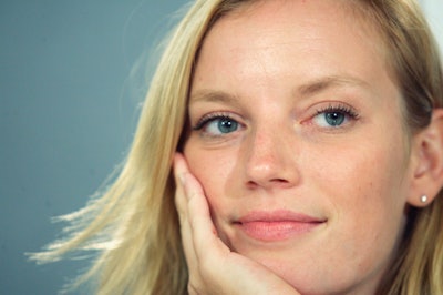 Sarah Polley posing with her hand on her cheek