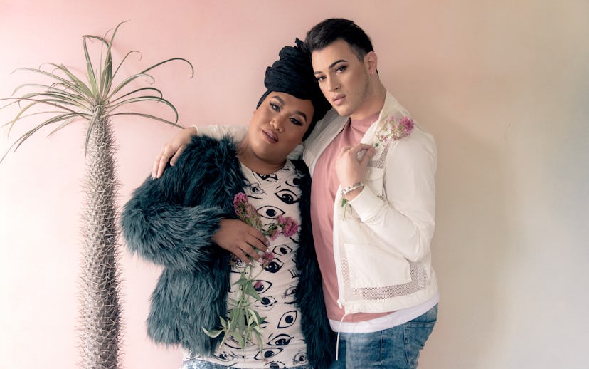 Manny Mua in a pink shirt, white jacket, and blue denim jeans and Patrick Starrr in a black-white sh...