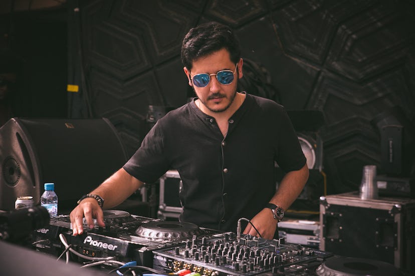 DJ Fassi from Morocco performing in a black shirt and sunglasses