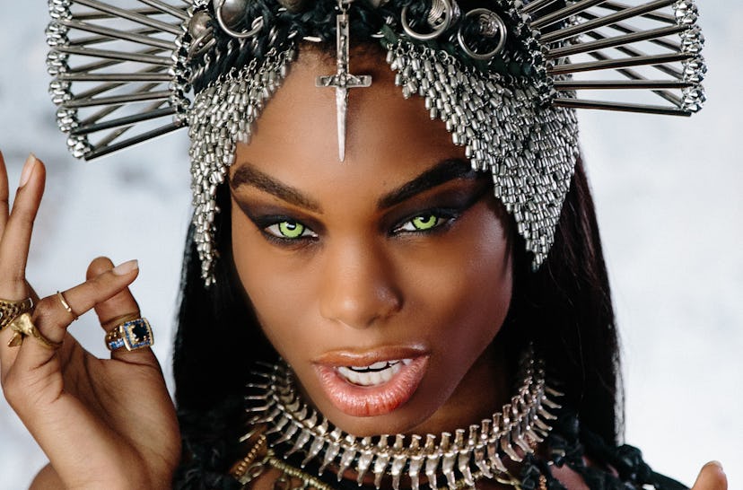 Queen of the Damned, vampire accentuating her green eyes, strong black eye make-up and simple nude l...