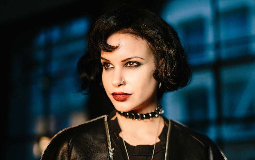 Nancy Downs with a strong make-up look, black eyeliner and red lipstick