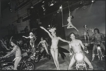 A ballet of mopeds on a stage