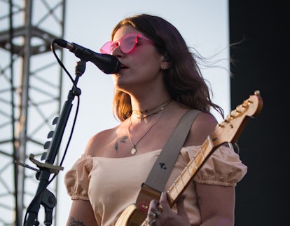 Bethany Cosentino from Best Coast singing and playing guitar on stage 