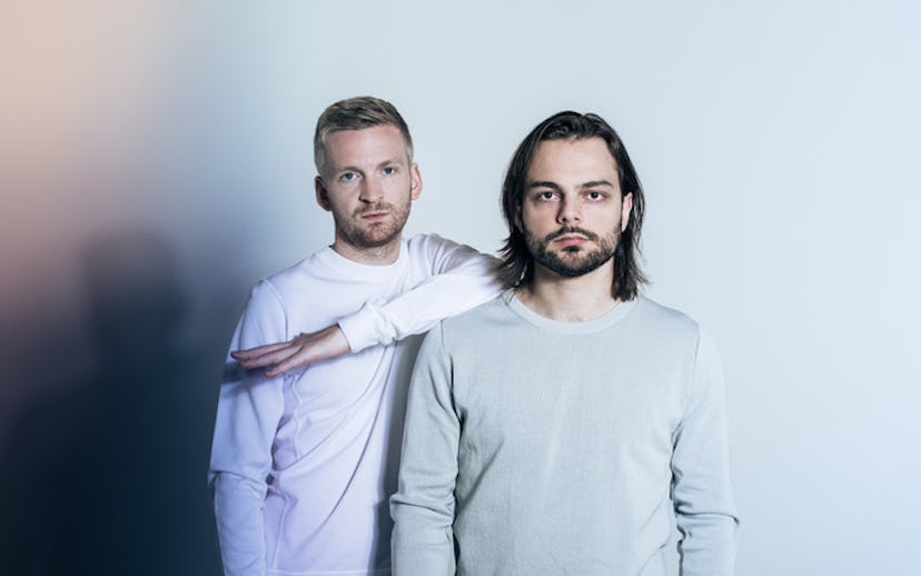 Kiasmos, a duo of techno wizards, standing next to each other in light-colored shirts
