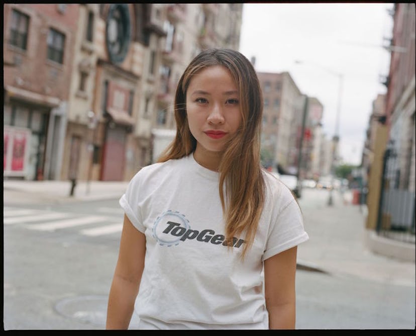 Sandy Liang walking down the street in a white "TopGear" shirt
