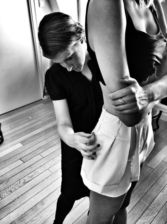 Audra Danielle Noyes taking measurements for a mini skirt