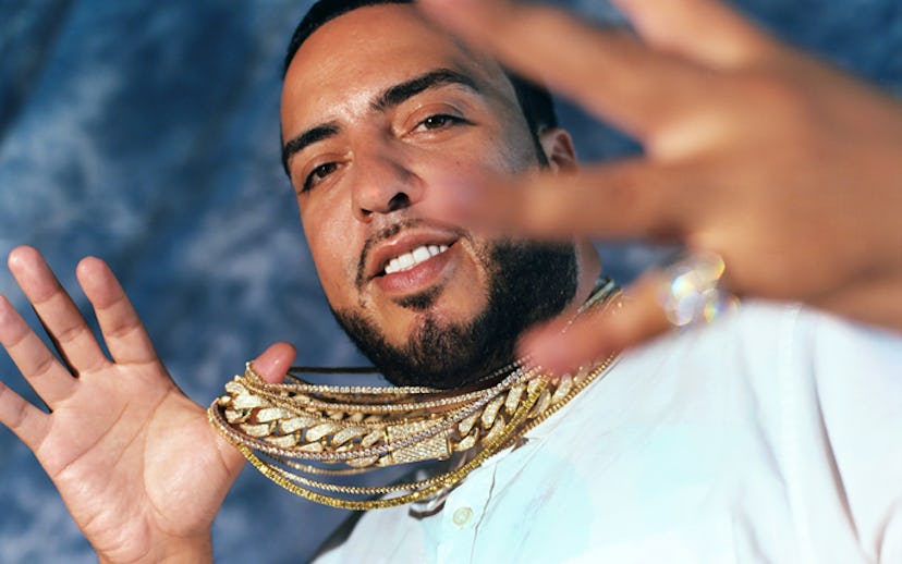 French Montana wearing a white button down shirt and four thin gold chains and a chain with diamonds