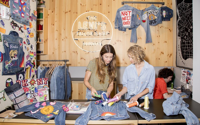 The Levi's Tailor Shop with two women working on Levi's jeans