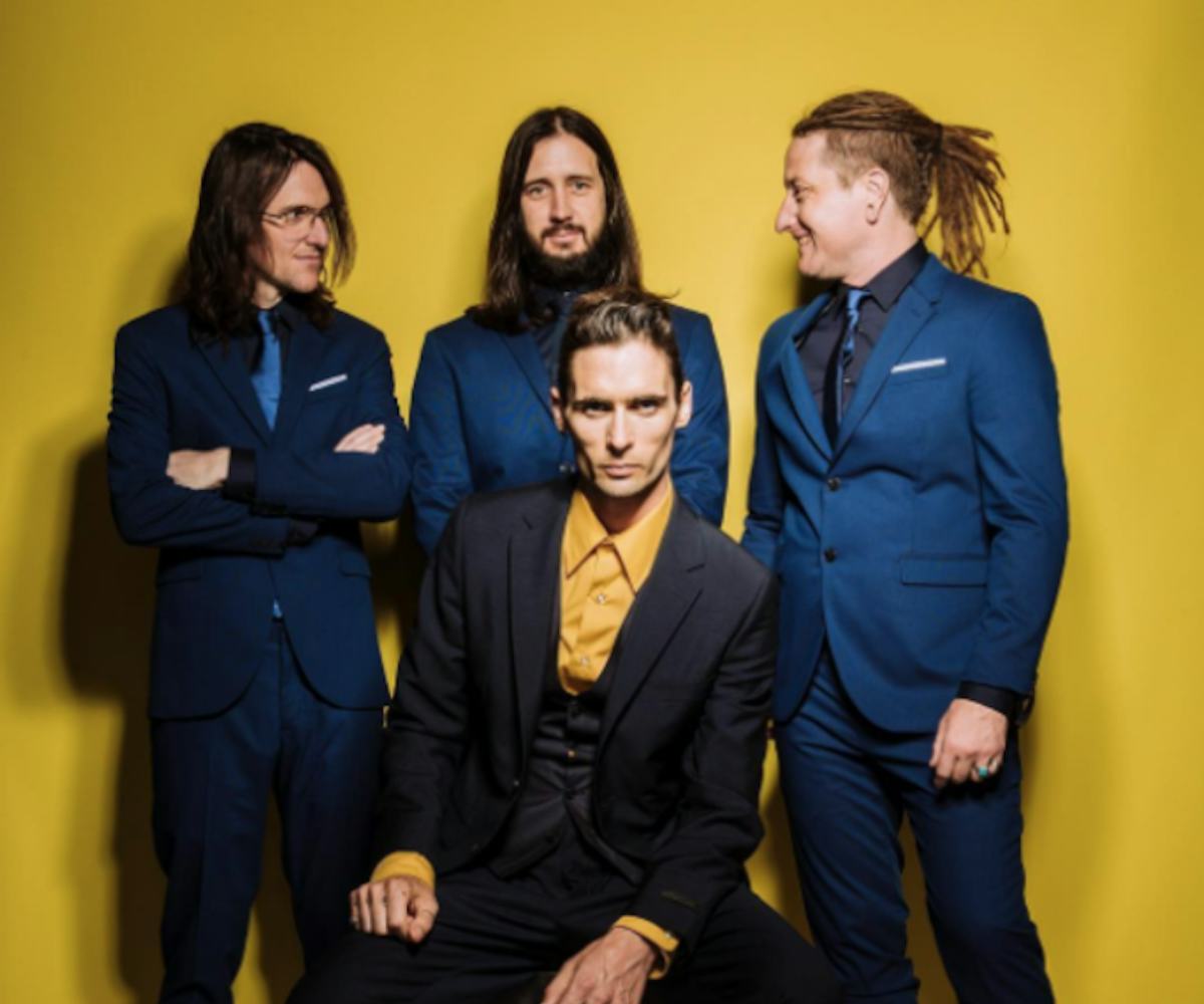 Tyson Ritter, Nick Wheeler, Mike Kennerty, Chris Gaylor from The All-American Rejects posing in suit...