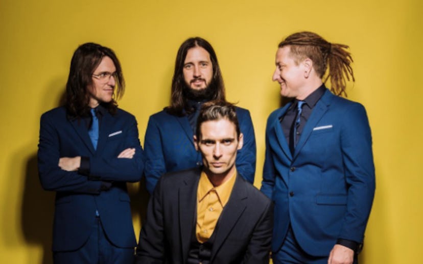 Tyson Ritter, Nick Wheeler, Mike Kennerty, Chris Gaylor from The All-American Rejects posing in suit...