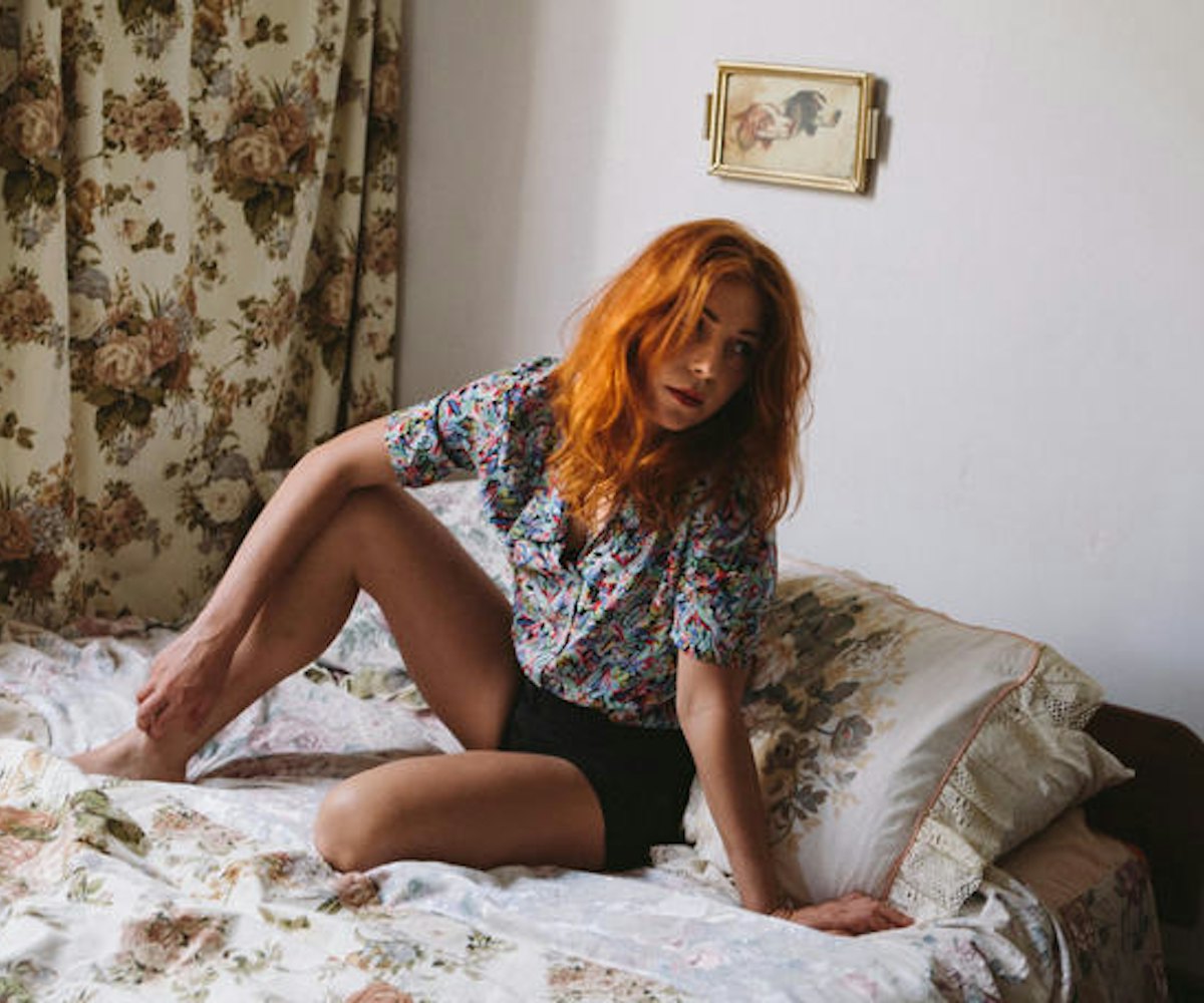 Singer, songwriter, and producer Jess Cornelius in a floral short-sleeved shirt and black shorts whi...