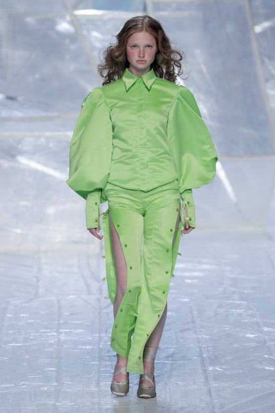 A female model wearing a lime green outfit