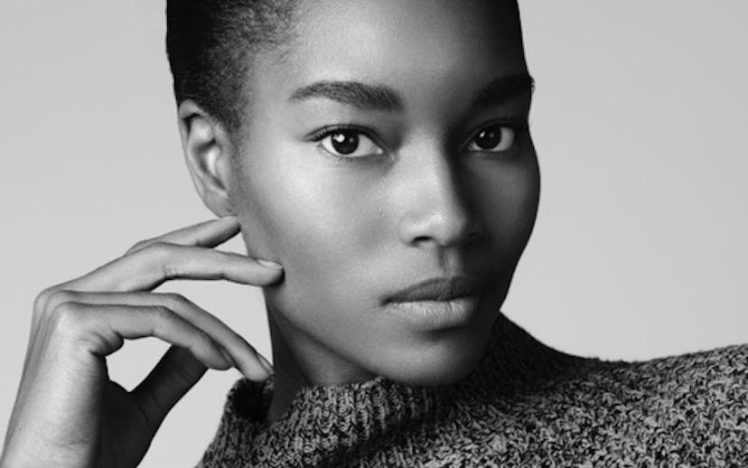 Model-entrepreneur Damaris Lewis posing while wearing a woolen jumper in a black and white closeup p...