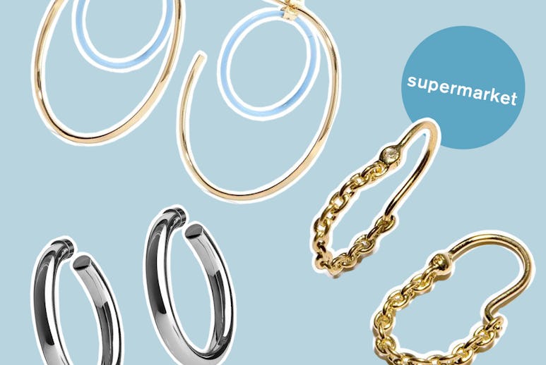 Three of the ten hoop earring pairs that people love at every price point with a light blue backgrou...