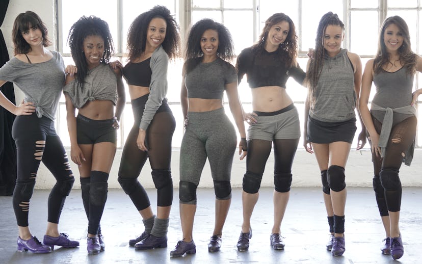 Group picture of the Syncopated ladies, Chloe, Maud, and others wearing gray shirts and leggings for...