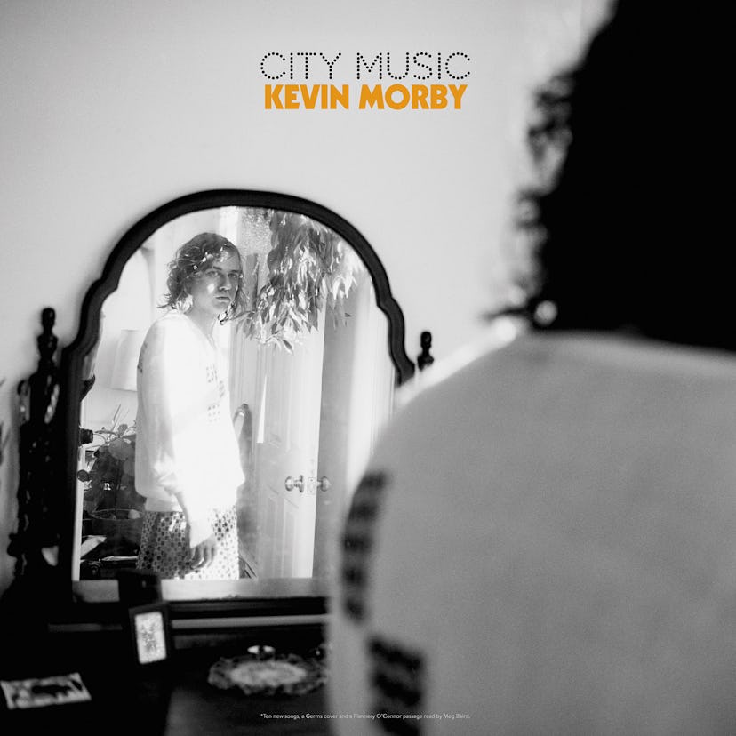 Kevin Morby on the cover of City Music in black and white looking at his reflection in the mirror 