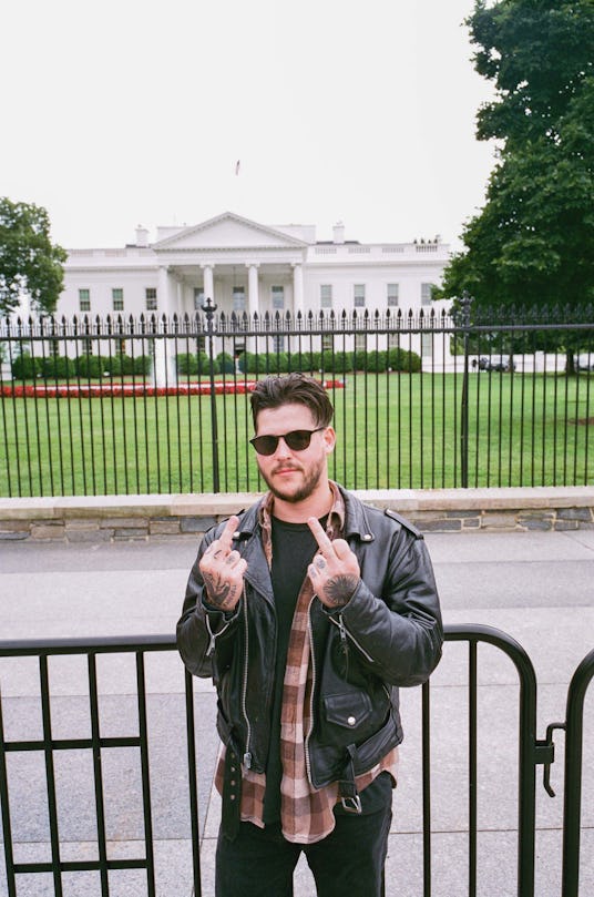 Nathan Williams of the Wavves band showing his middle finger in front of the White House