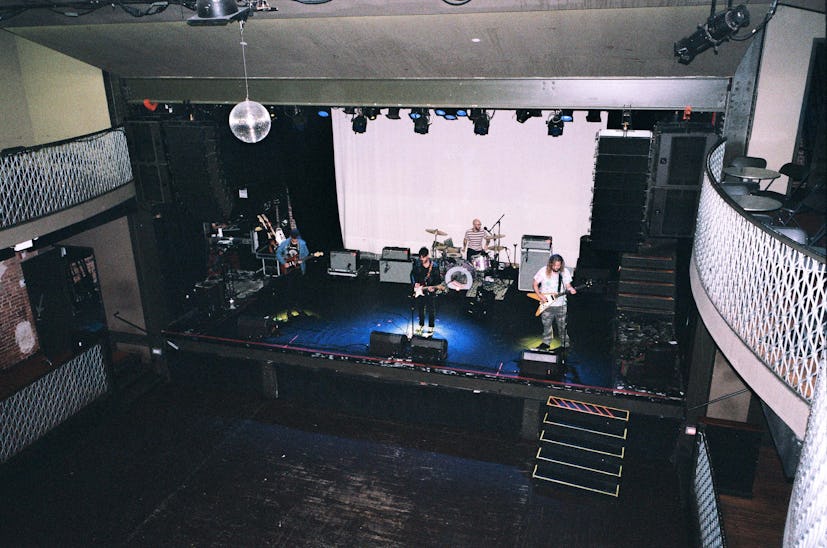 The members of the Wavves band doing a sound check on a stage