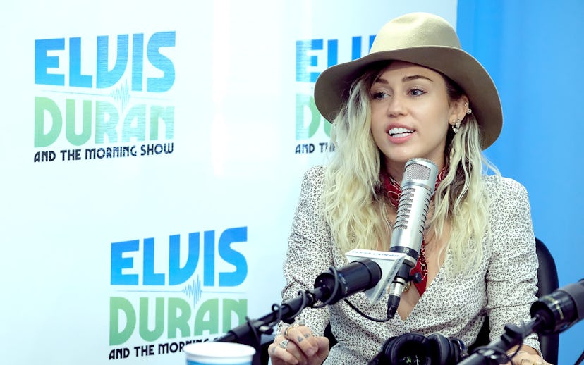 Miley Cyrus on the Elvis Duran and the Morning Show in a beige hat 