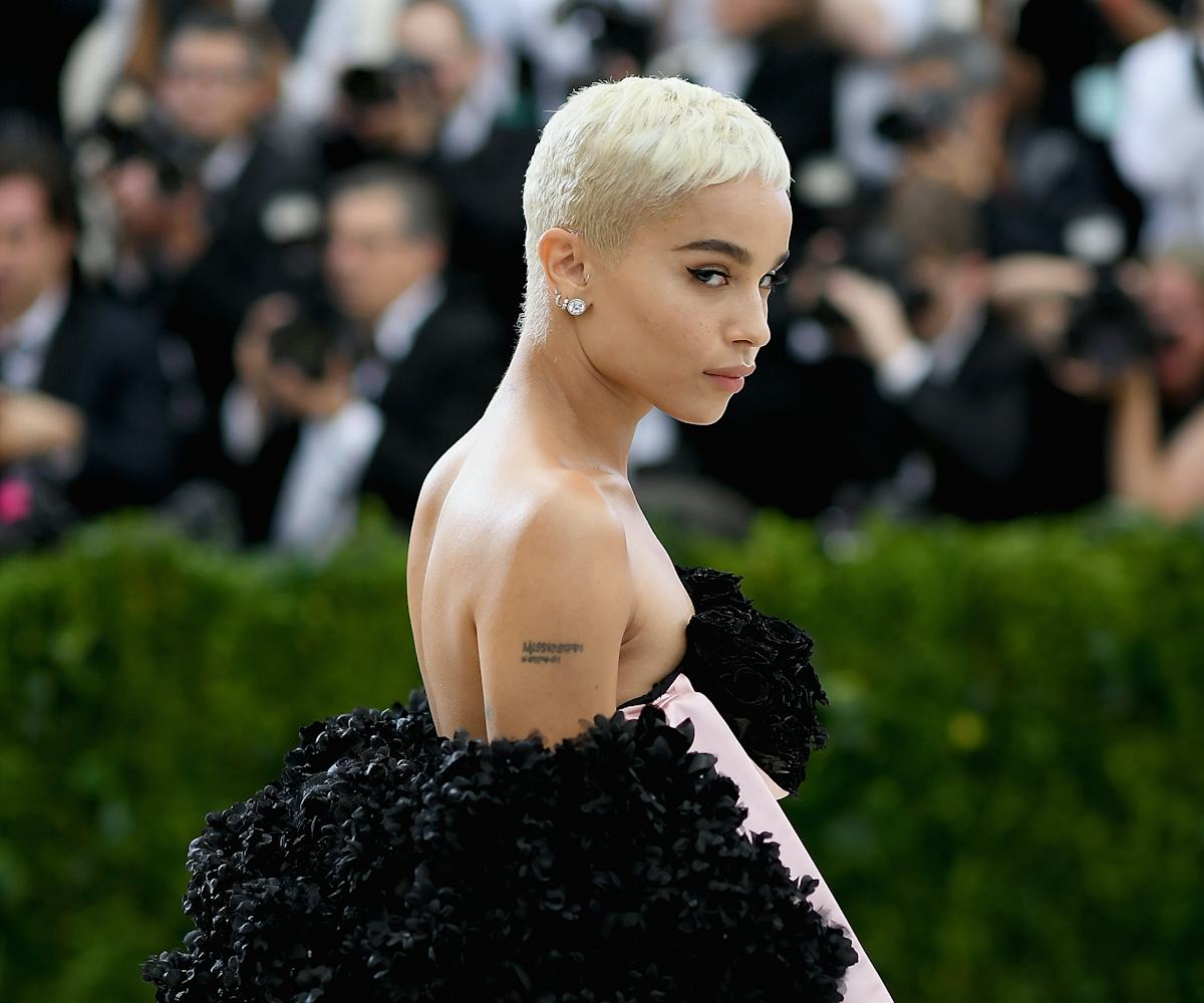 Zoë Kravitz looking over her right shoulder at the 2017 Met Gala in a pink and black Oscar de la Ren...