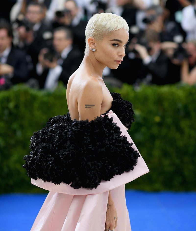 Zoë Kravitz looking over her right shoulder at the 2017 Met Gala in a pink and black Oscar de la Ren...