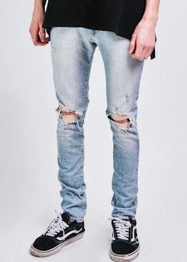 A male model wearing the Daniel Patrick classic ripped skinny jean II jeans