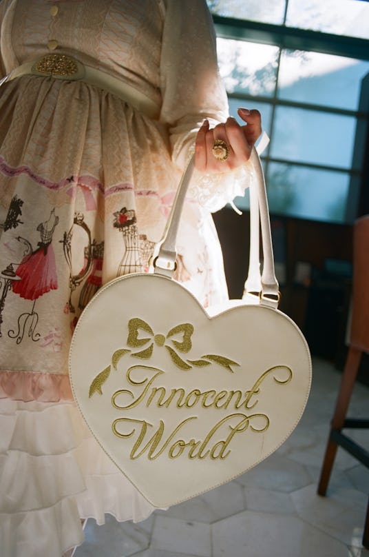 Heart shaped bag with text "Innocent World" in gold