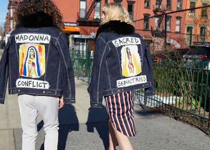 Saint Vivian Wrath jackets saying "Madonna conflict" and "Sacred seductress" worn by two female mode...
