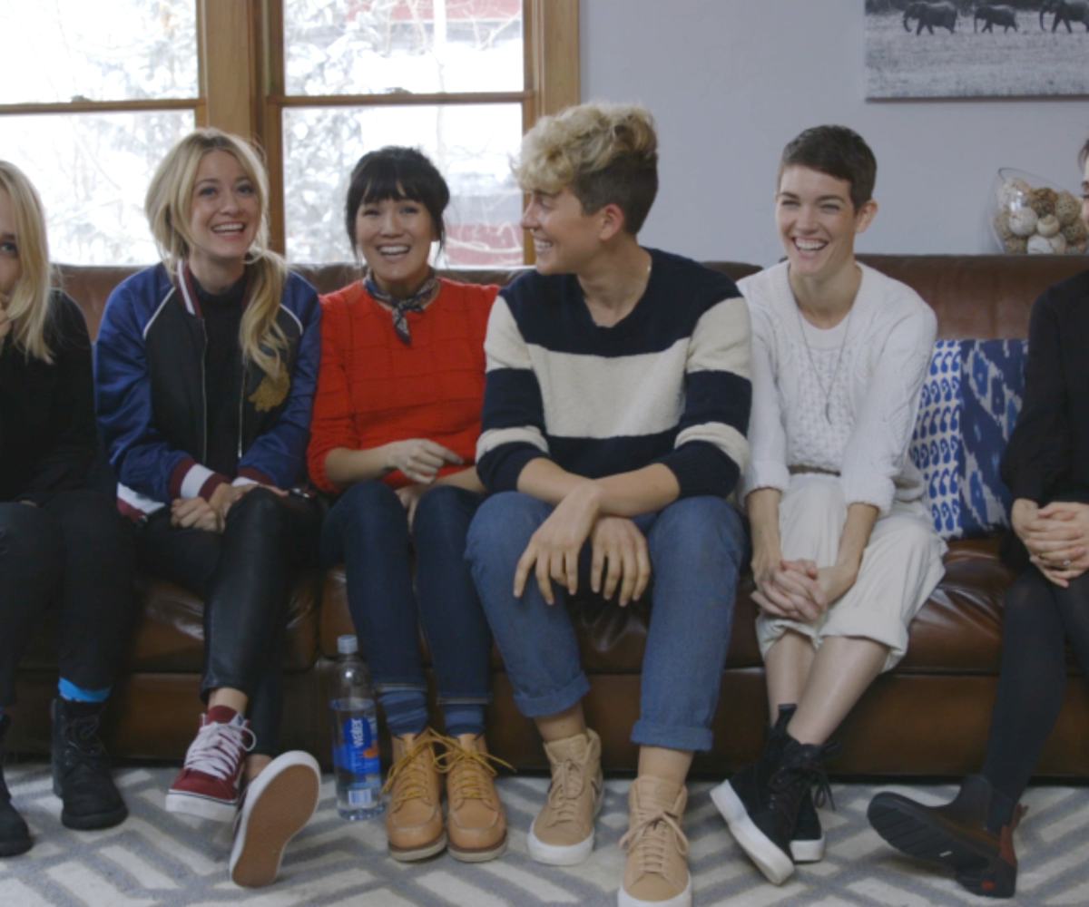 Stranger's cast sitting on a couch