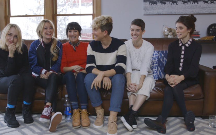 Stranger's cast sitting on a couch