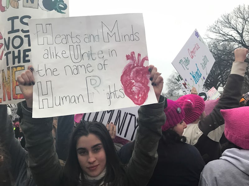 Fifth Harmony's Lauren Jauregui at a Women's March with a sign "Hearts and Minds alike Unite in the ...