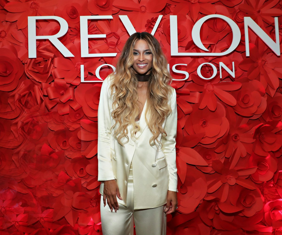 American singer Ciara in front of the "Revlon Love Is On" red rose wall