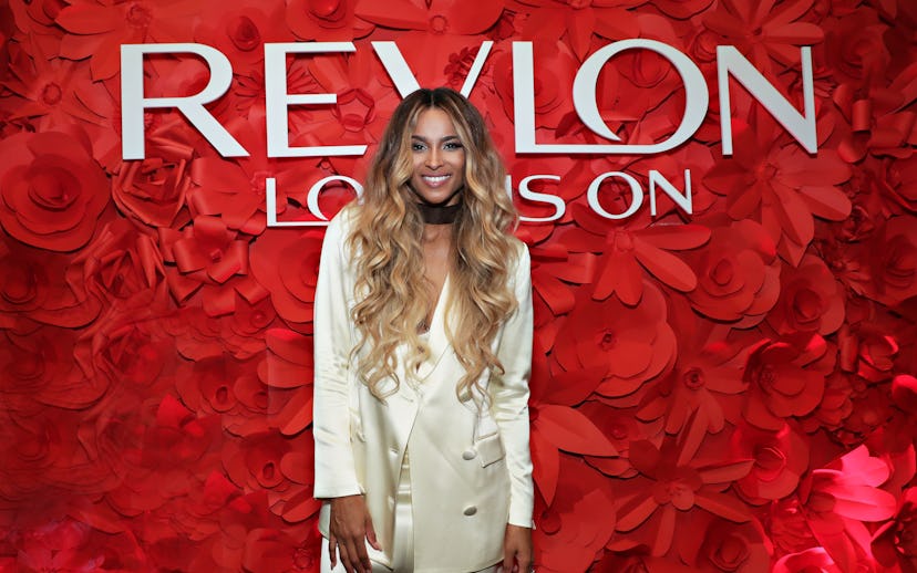 American singer Ciara in front of the "Revlon Love Is On" red rose wall