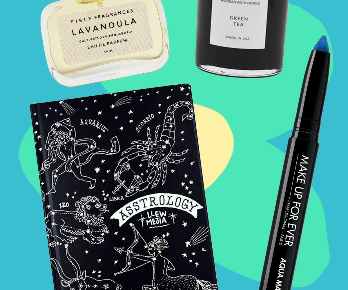 Gifts from The Best Black Friday Steals which include a candle, blue Glide On Shadow, notebook and a...
