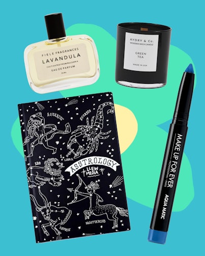 Gifts from The Best Black Friday Steals which include a candle, blue Glide On Shadow, notebook and a...