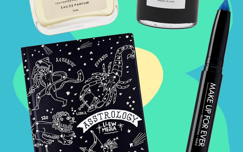 Gifts from The Best Black Friday Steals which include a candle, blue Glide On Shadow, notebook and a...