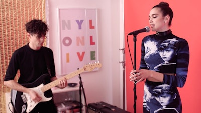 Dua Lipa performing the acoustic version of her hit single on Nylon's Show + Tell.