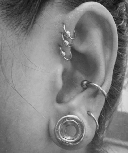 A pierced ear with multiple loop piercings 