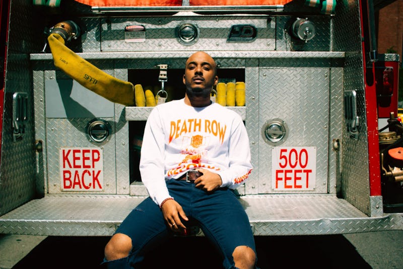 Caleborate sitting on the firefighters' truck 