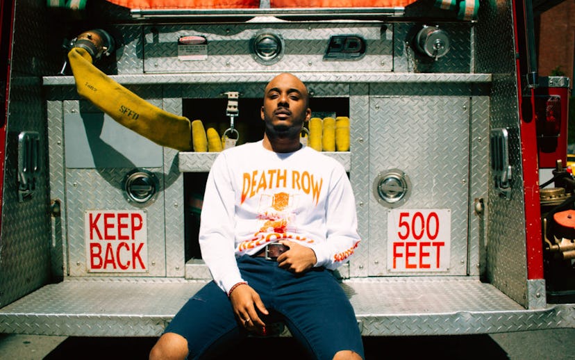 Caleborate sitting on the firefighters' truck 
