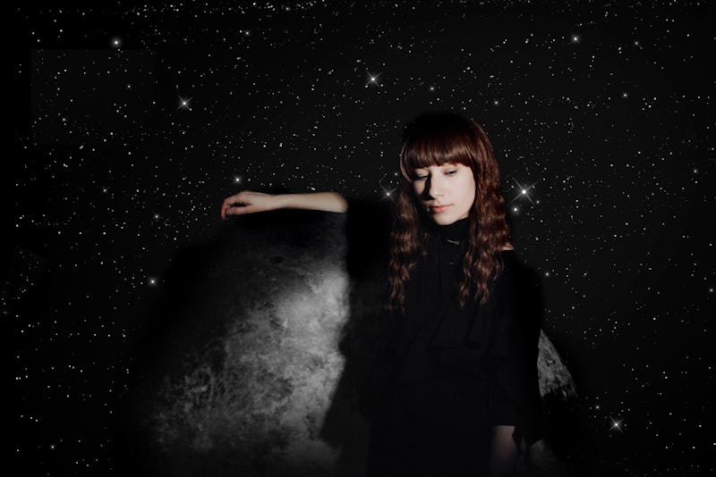 Singer Emily Reo in front of a galaxy background while breaking down notions of normativity in music