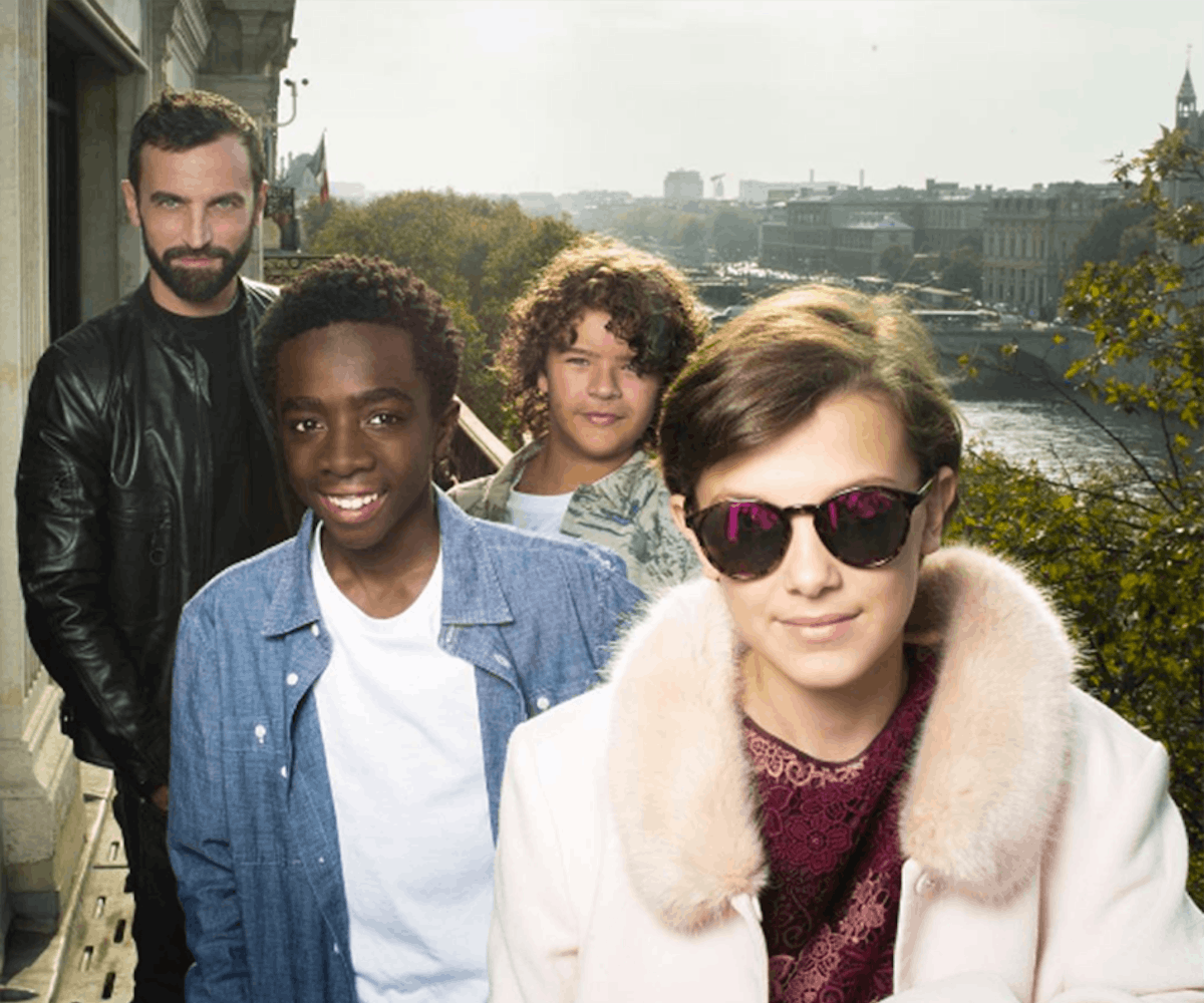  ‘Stranger Things’ Kids standing on a balcony wearing louis vuitton clothing
