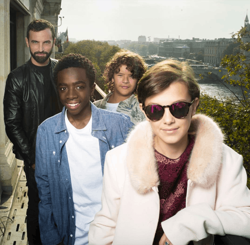 ‘Stranger Things’ Kids standing on a balcony while wearing Louis Vuitton outfits