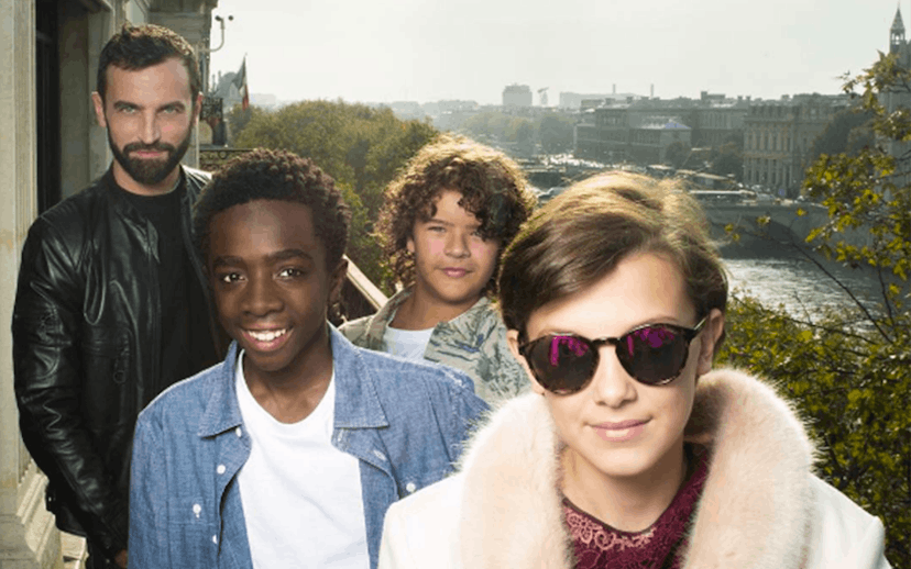 ‘Stranger Things’ Kids standing on a balcony while wearing Louis Vuitton outfits