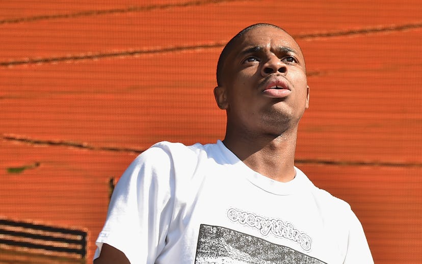 Vince Staples wearing a white shirt with "everything" on it, looking up