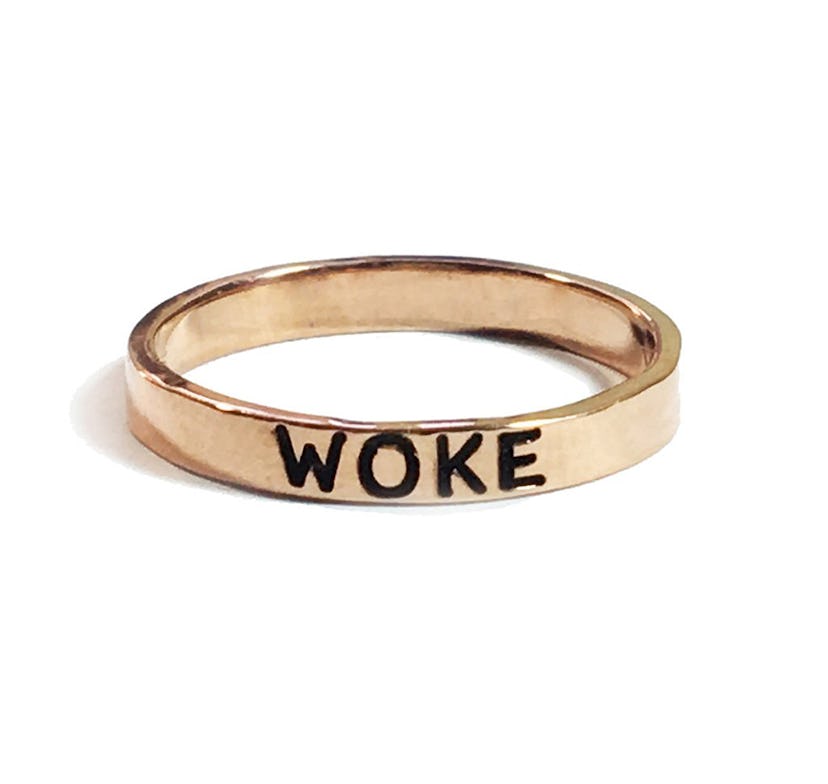 NYLONshop x Tawnie & Brina Collaboration, rose gold ring with "Woke" engraved on it