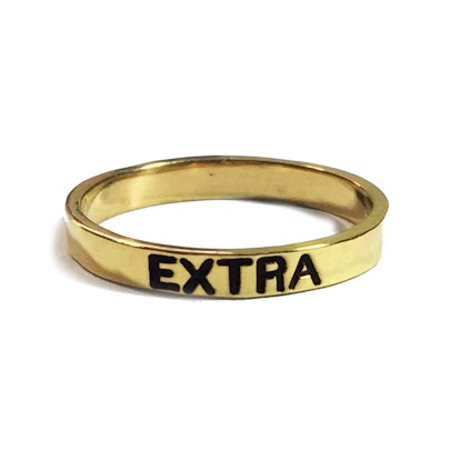 NYLONshop x Tawnie & Brina Collaboration, gold ring with "Extra" engraved on it